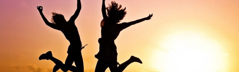 Person jumping joyfully outdoors